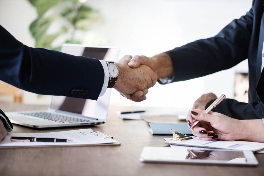Image for buying a business what is involved - handshake