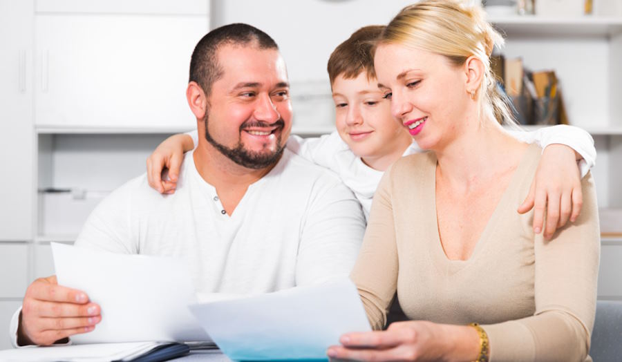 Image of couple with son checking their wills for Plymouth Wills Solicitor New article