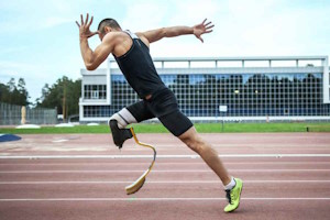 Disabled athlete sprinting on race track for personal injury link on litigation solicitor page